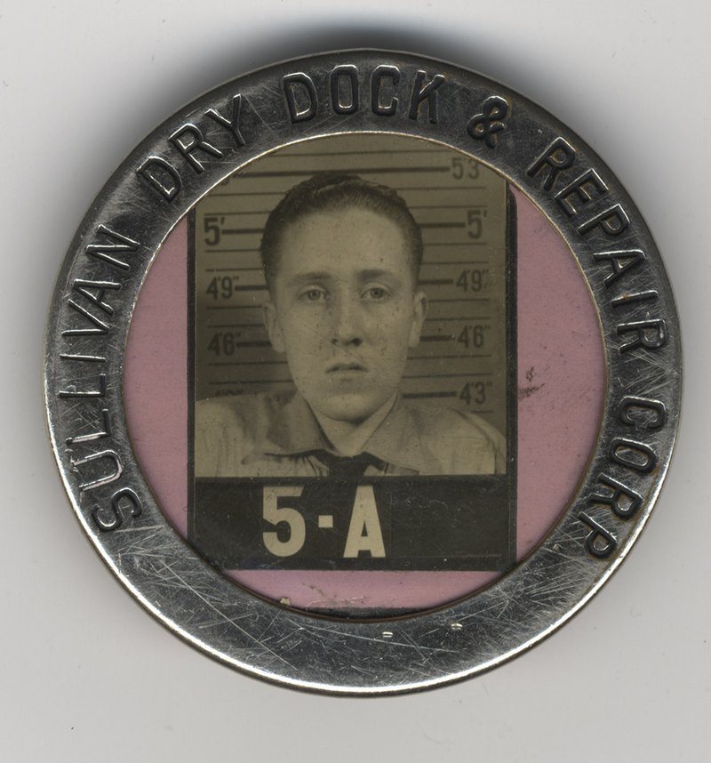 Joe's work badge from the Sullivan Dry Dock & Repair Corp.